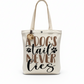 Beige tote bag with 'A dog's tail never lies' text on a white background