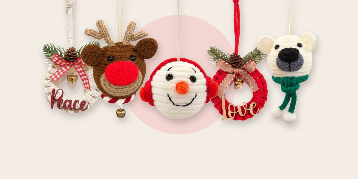 Handmade Christmas ornaments: a crochet snowman, reindeer and polar bear, and two wreaths
