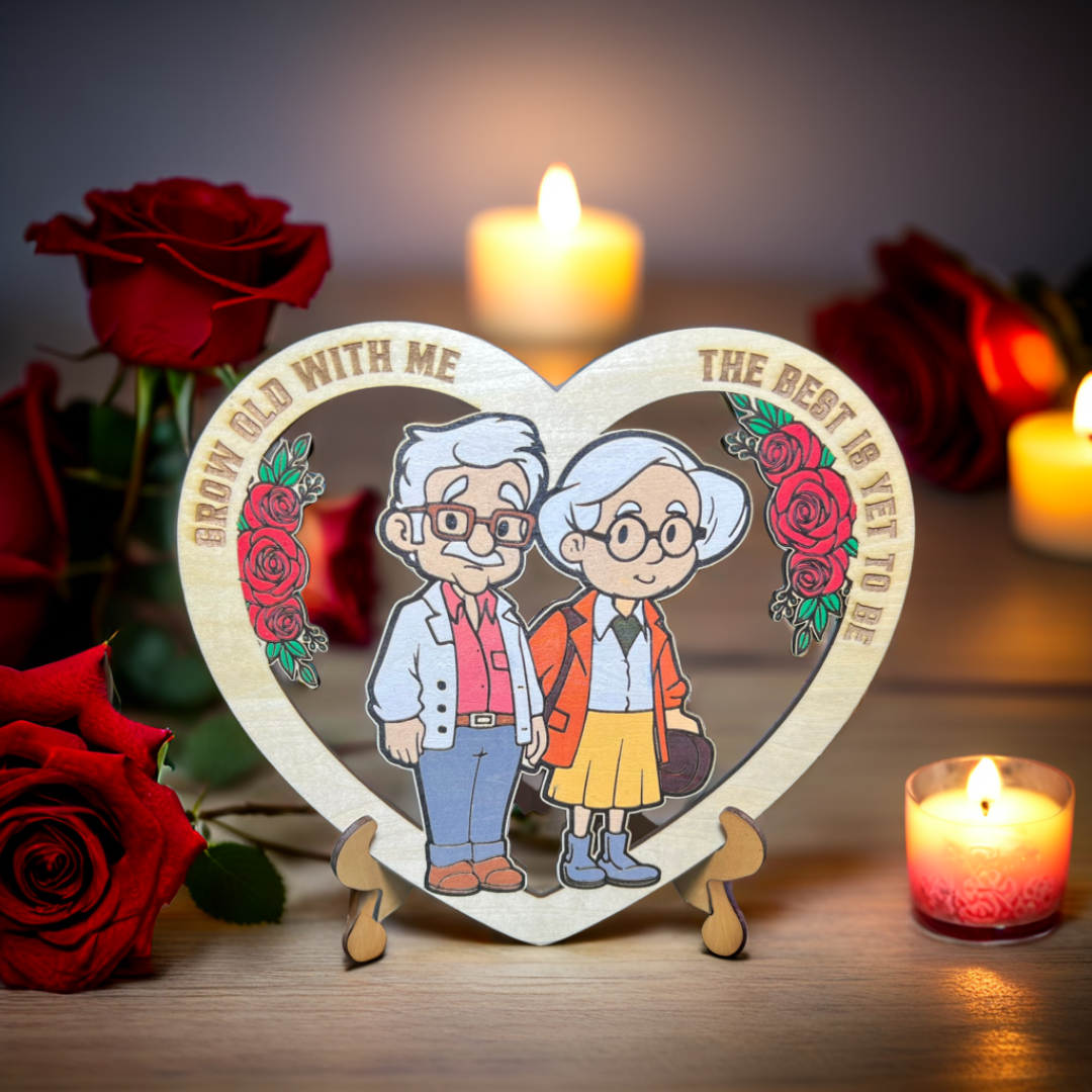 Heart-shaped wooden plaque with cartoon grandparents and roses, surrounded by candles and red roses.