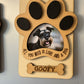Paw print wooden photo magnet with a schnauzer photo, "All you need is love and a dog" and the name GOOFY, on a fridge