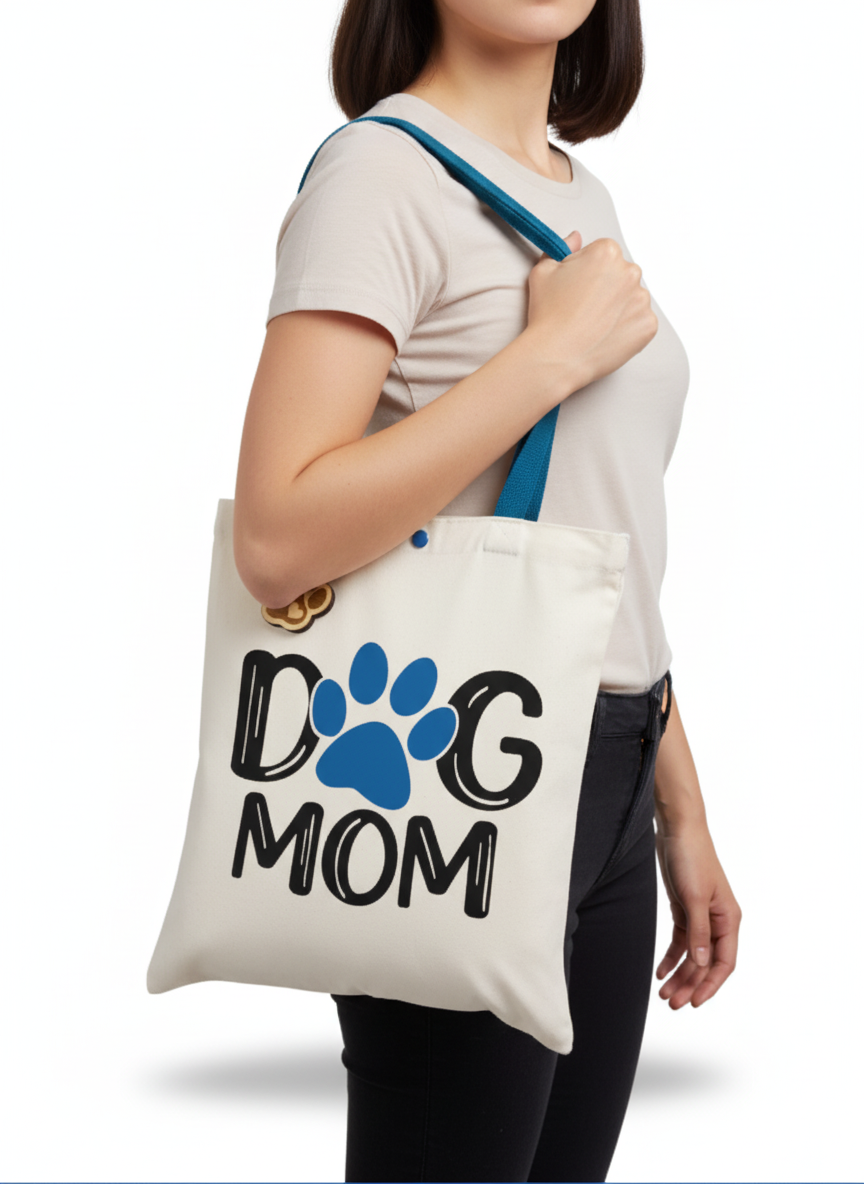 Rendering of a person holding a tote bag with 'Dog Mom' text and paw print design.
